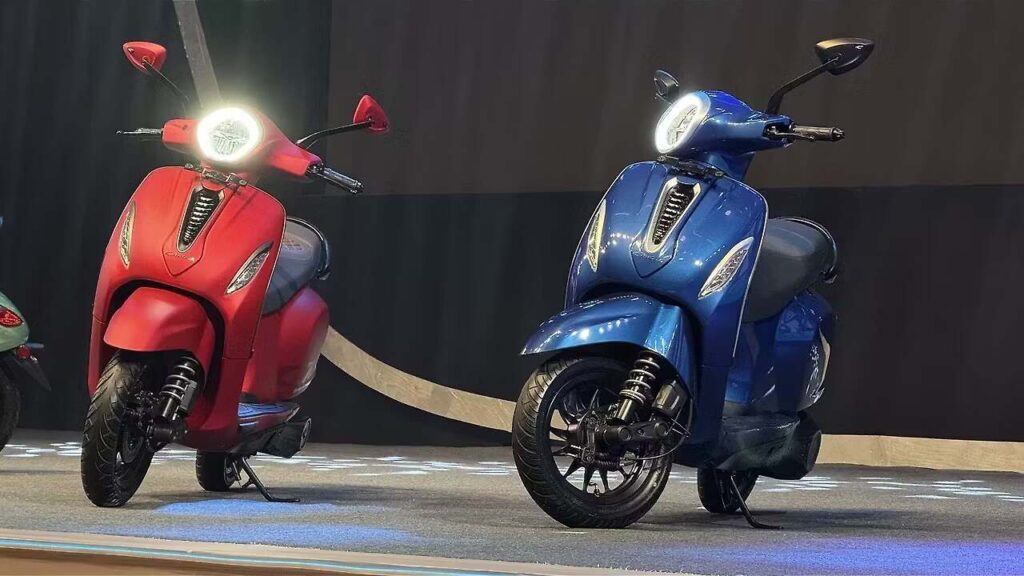 Bajaj Chetak 3001 electric scooter with 127 km range in red color parked on urban street