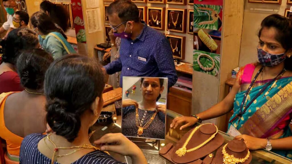 Gold jewelry displayed on a table, representing gold possession limits in India.