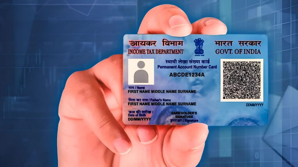 Person submitting PAN card correction form with documents