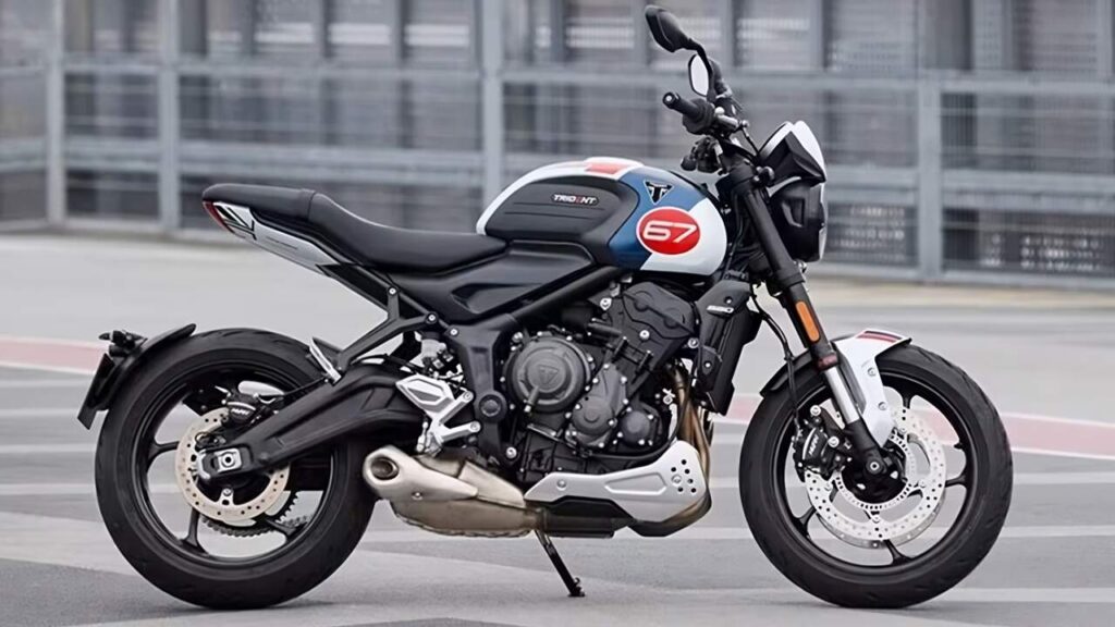 Triumph Trident 660 Special Edition on display with its tri-tone Slippery Sam livery featuring blue and red accents.