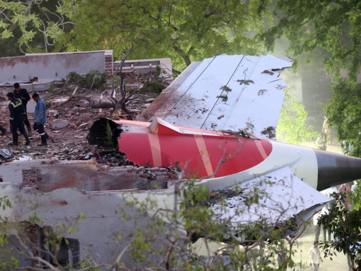 AAIB investigators examining Air India Flight 171 crash site in Ahmedabad for evidence collection.