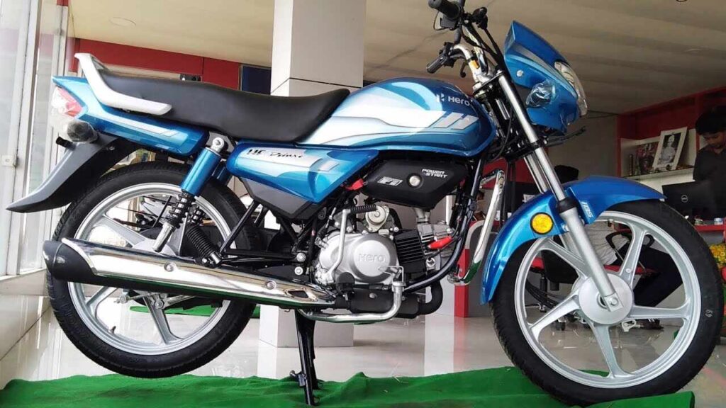 Hero HF Deluxe Pro 2025 motorcycle in action on Indian roads, highlighting its new graphics and chrome finish.
