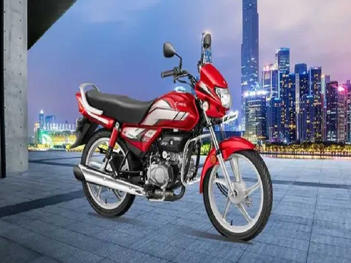Close-up view of Hero HF Deluxe Pro's LED headlamp, digital speedometer, and i3S technology features.