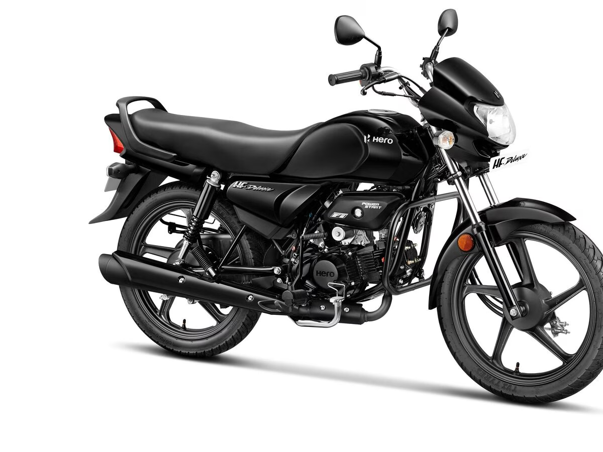 Hero HF Deluxe Pro 2025 motorcycle in action on Indian roads, highlighting its new graphics and chrome finish.