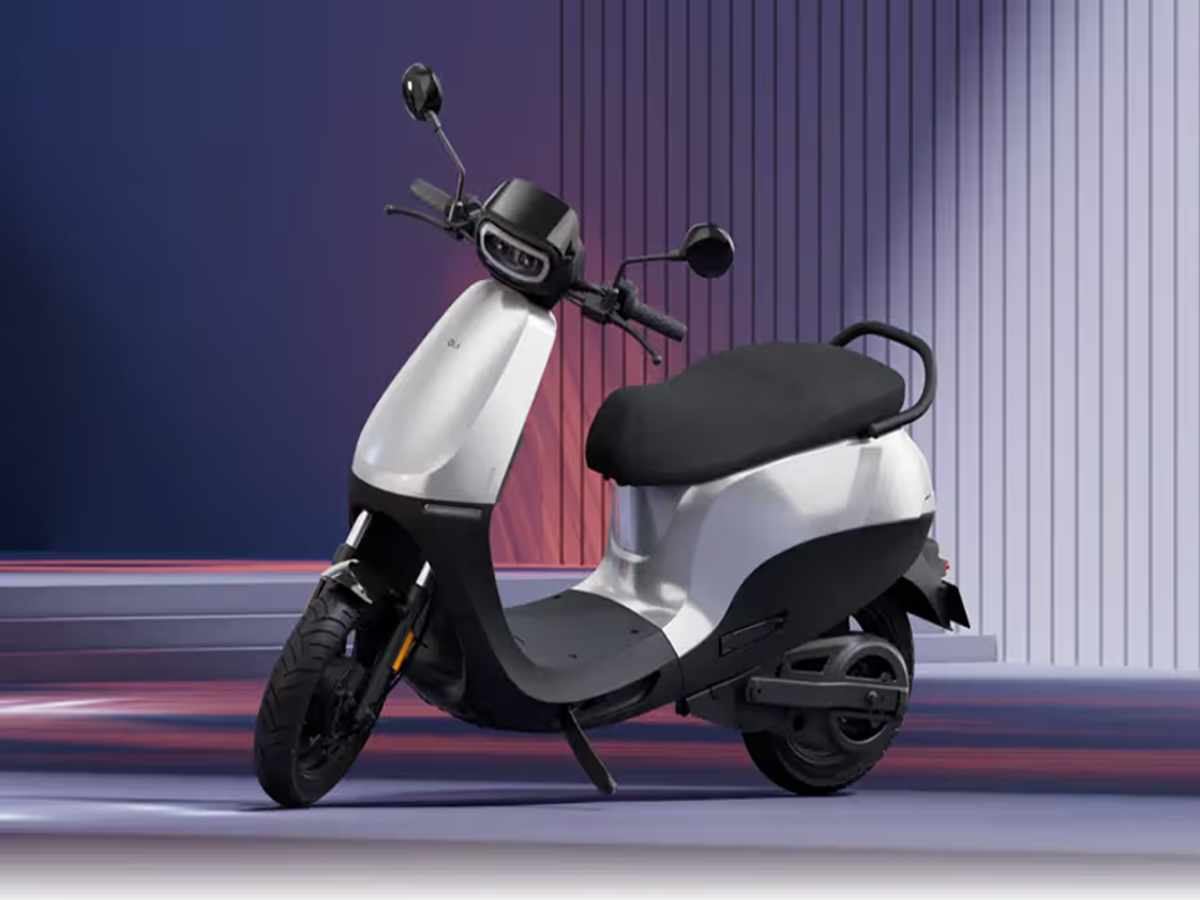 OLA S1 X electric scooter with removable battery parked in an urban setting.