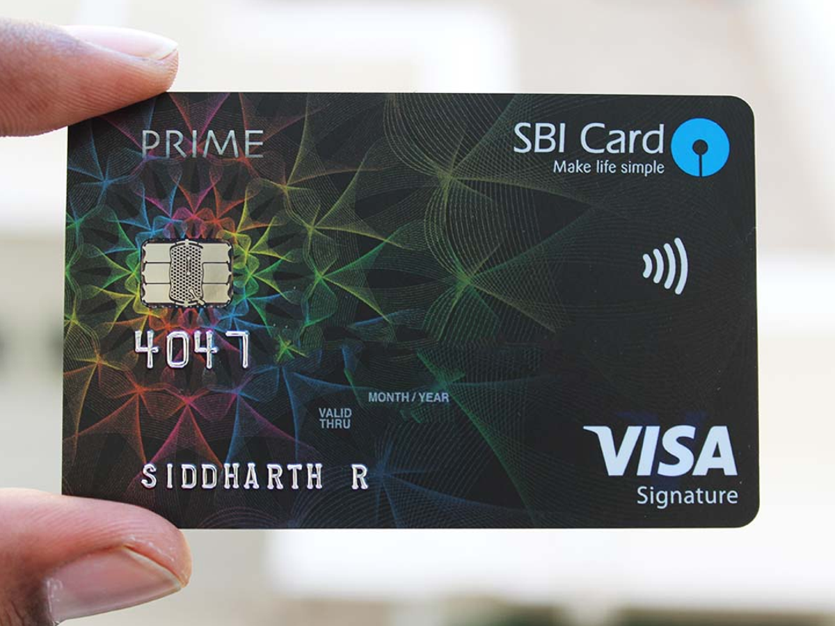 Close-up of SBI Card with travel insurance policy document