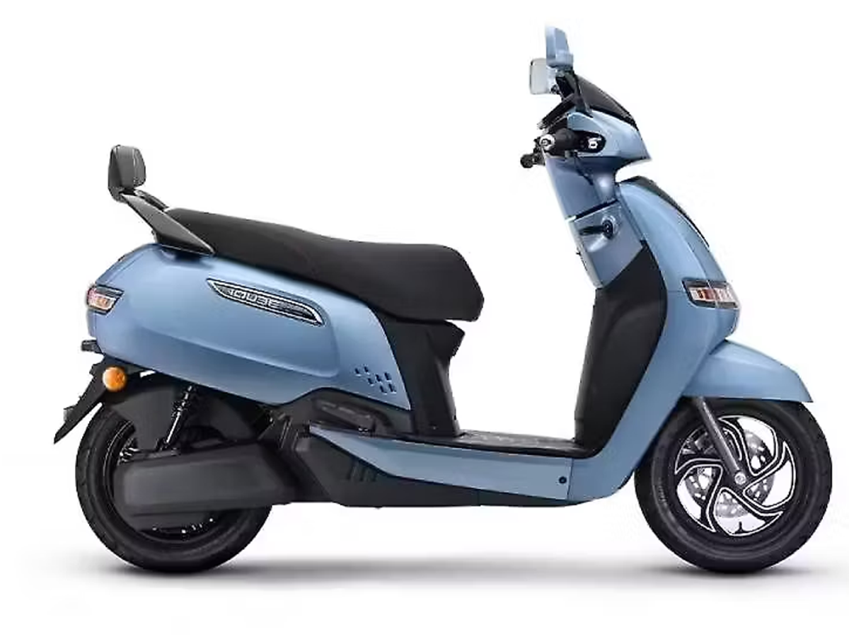 TVS iQube electric scooter with family, showcasing reliable build and comfortable seating for daily use in India.