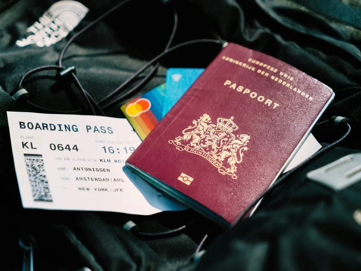 Smartphone displaying digital backup of travel documents on a cloud storage app.