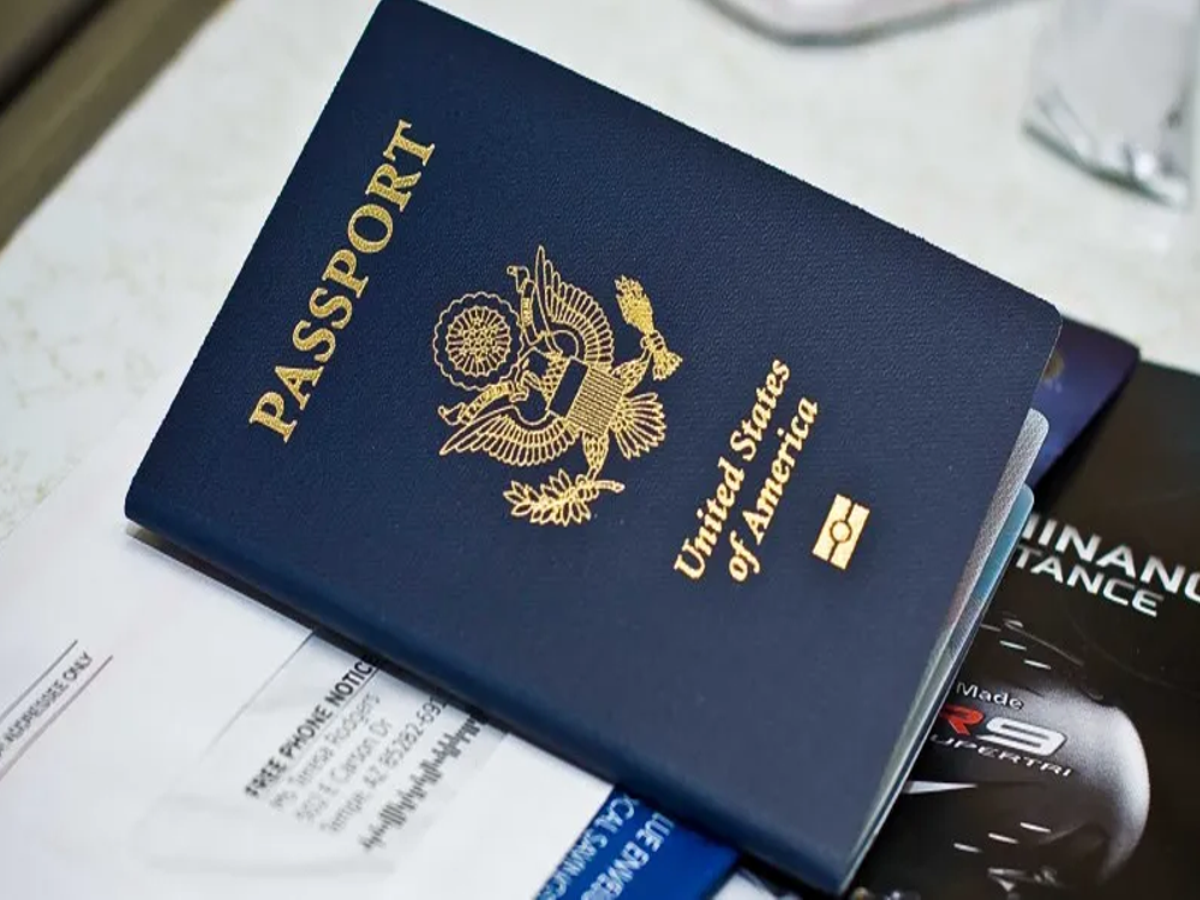 Passport and travel documents organized in a travel wallet for safe travel.