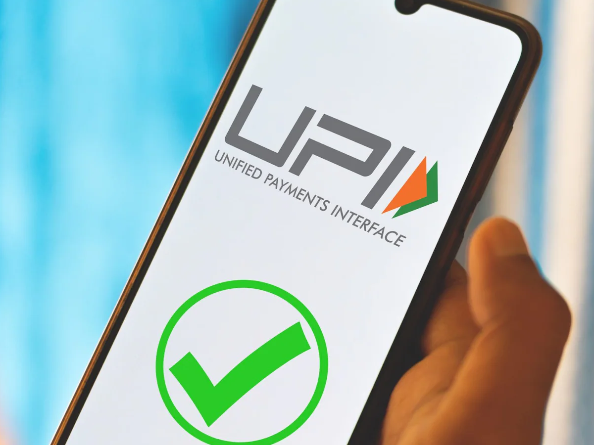 : Indian users checking UPI balance on mobile app with new limits