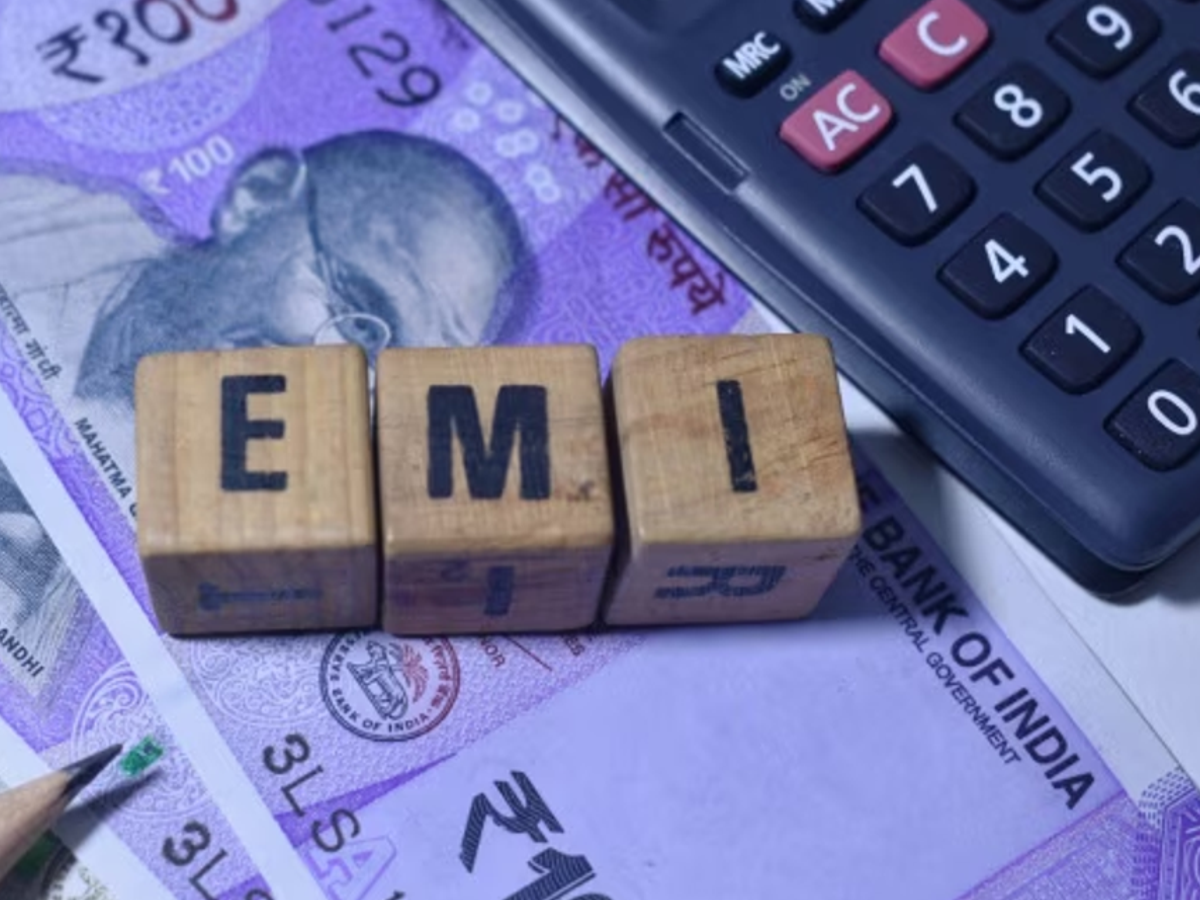 Illustration of a person checking bank statement with missed EMI notification and penalty alert in India, SEO optimized.