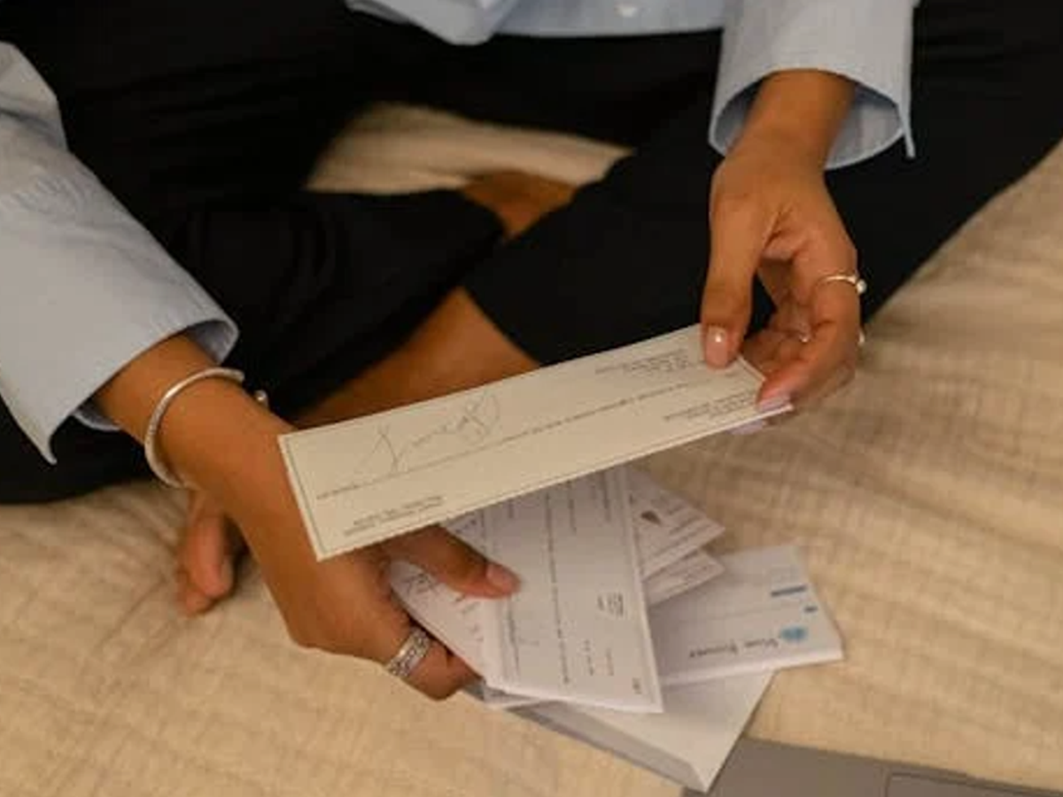Illustration of a bounced cheque with a bank rejection stamp, representing cheque bounce issues in India.