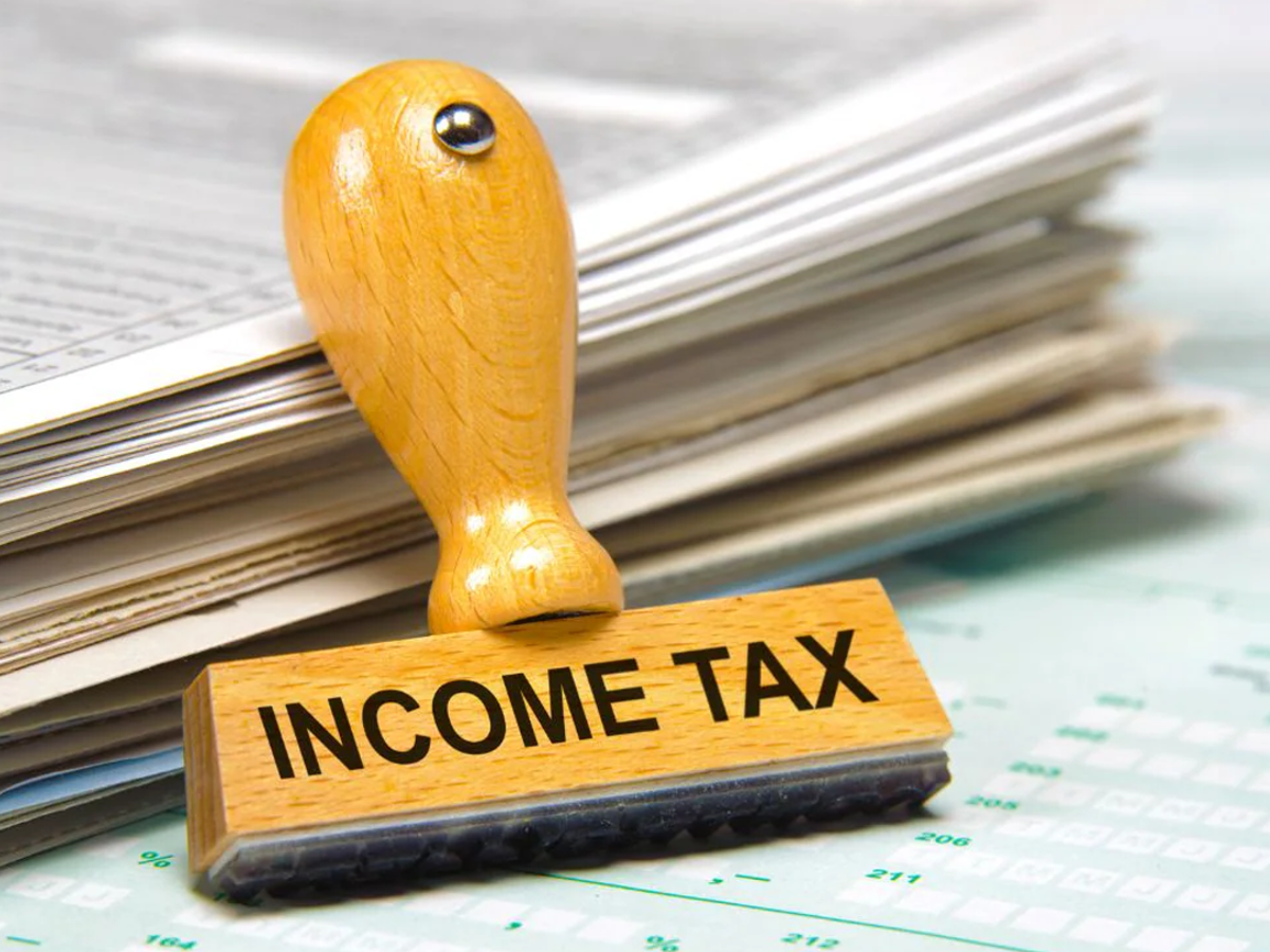 Senior citizens discussing tax exemptions with bank official