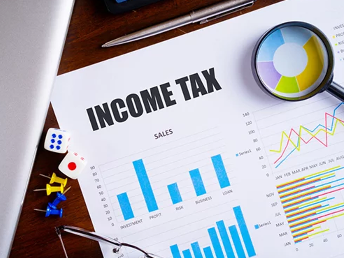 Image showing tax experts discussing the benefits and challenges of the Income Tax Bill 2025, designed for accessibility.
