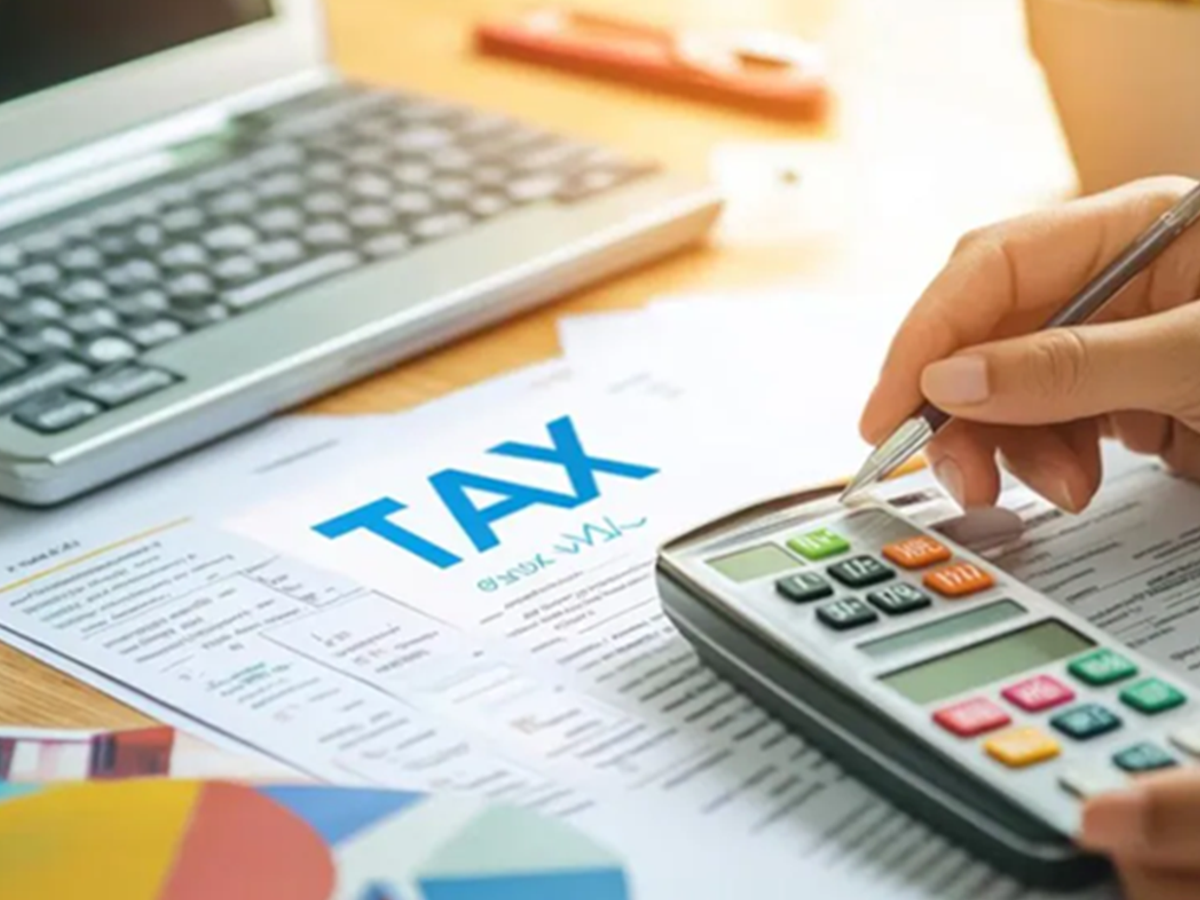 Person checking bank statements to avoid income tax notices from large investments