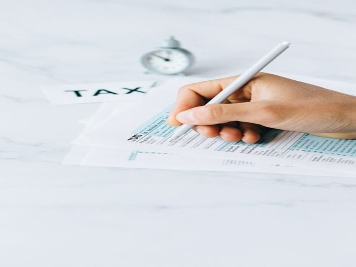 Senior citizen reviewing income tax exemption details with a tax