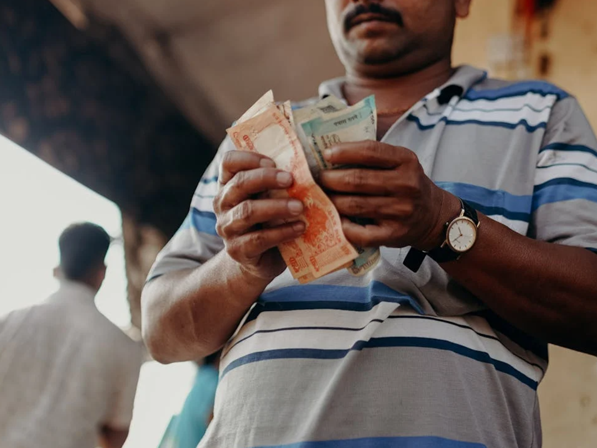 Farmer submitting PM Kisan documents at a Common Service Center in Karnataka