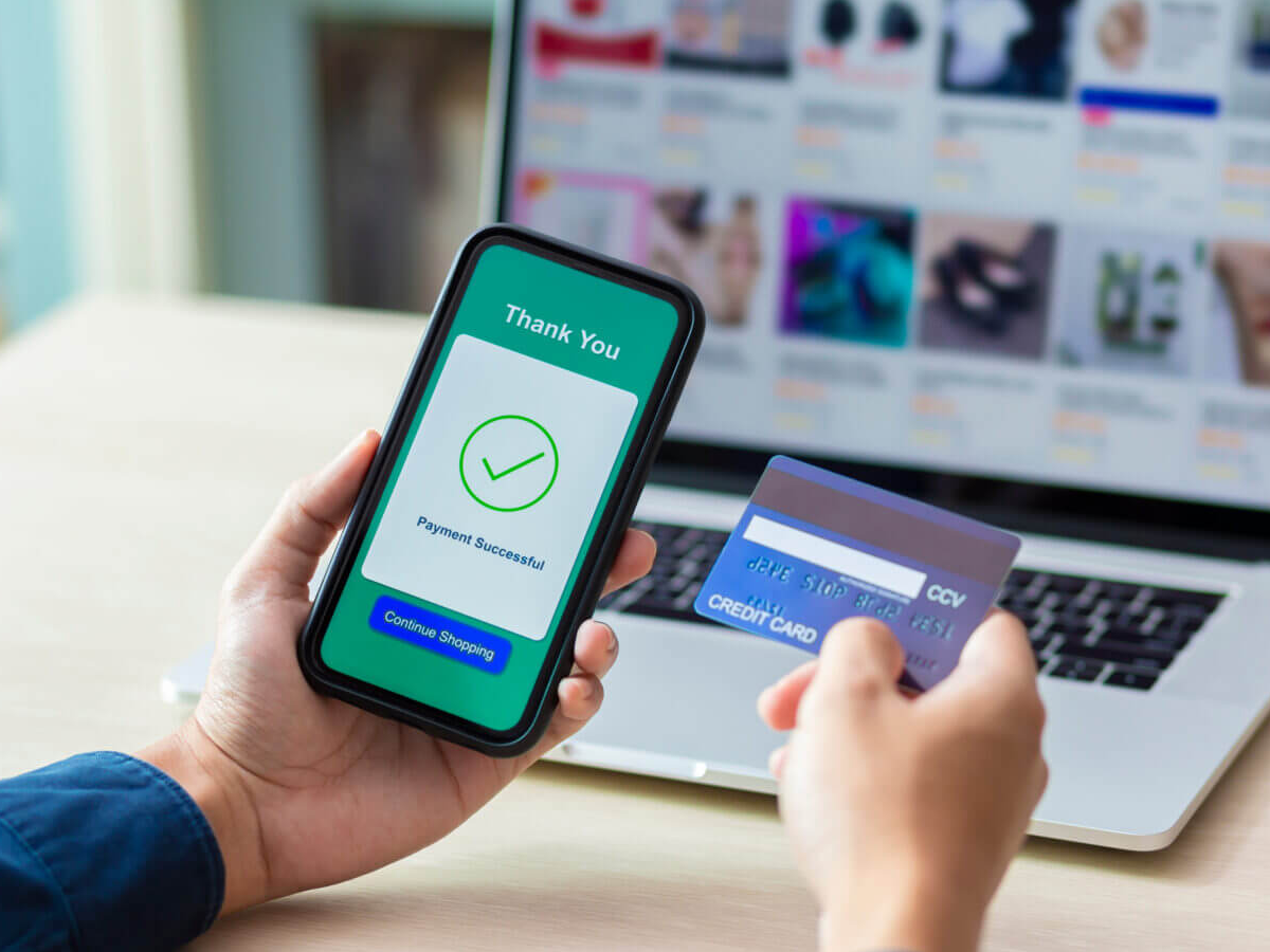 Illustration of a smartphone screen showing biometric authentication options like fingerprint and face ID for secure online payments with Federal Bank SmilePay.