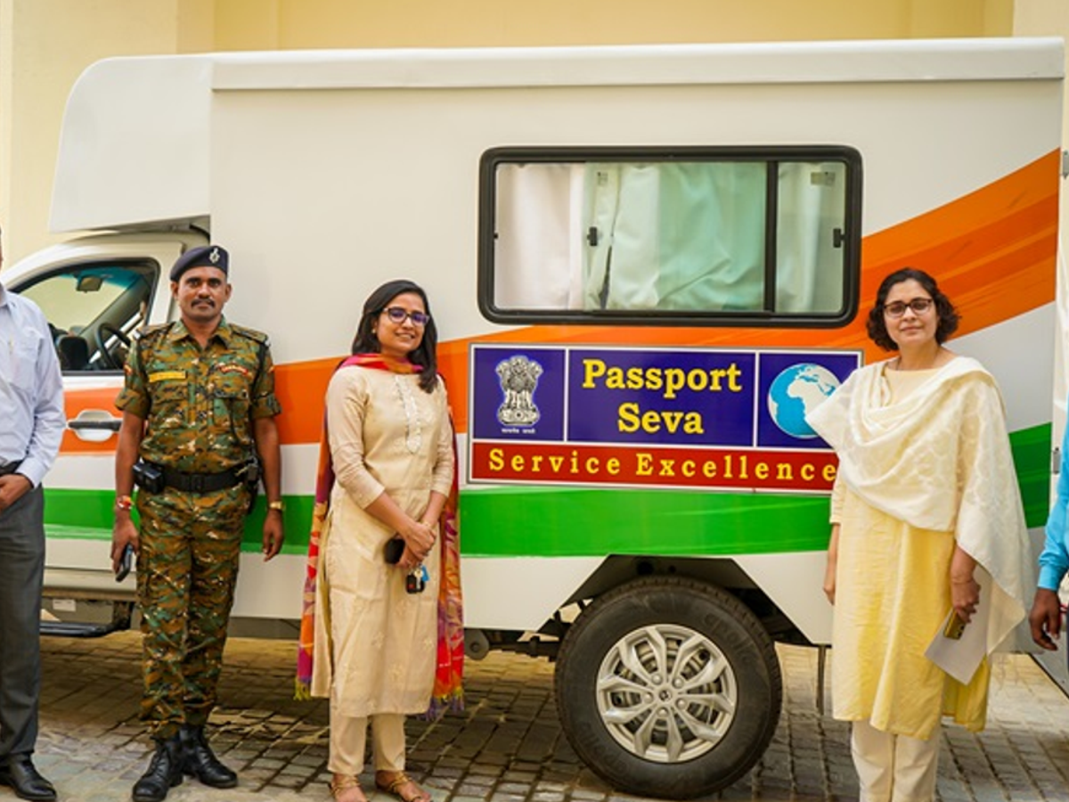 Citizens submitting passport applications inside a Mobile Passport Van in a remote area of Northeast India