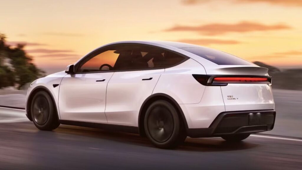 Tesla Model Y electric SUV on display at Mumbai’s BKC showroom, showcasing sleek design and advanced technology.