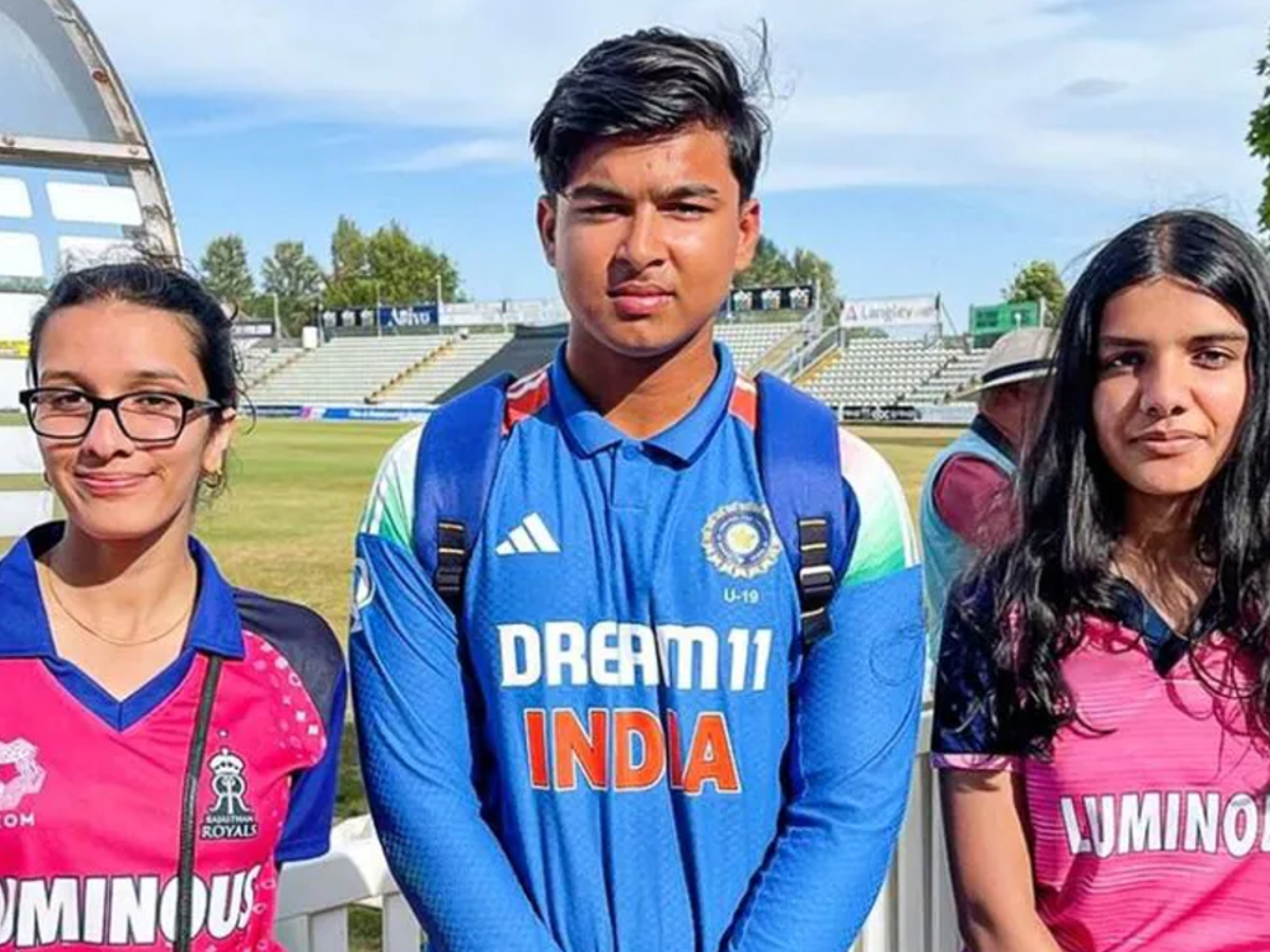 Vaibhav Suryavanshi posing with fans Aanya and Rivaa in Rajasthan Royals pink jerseys in Worcester, England.