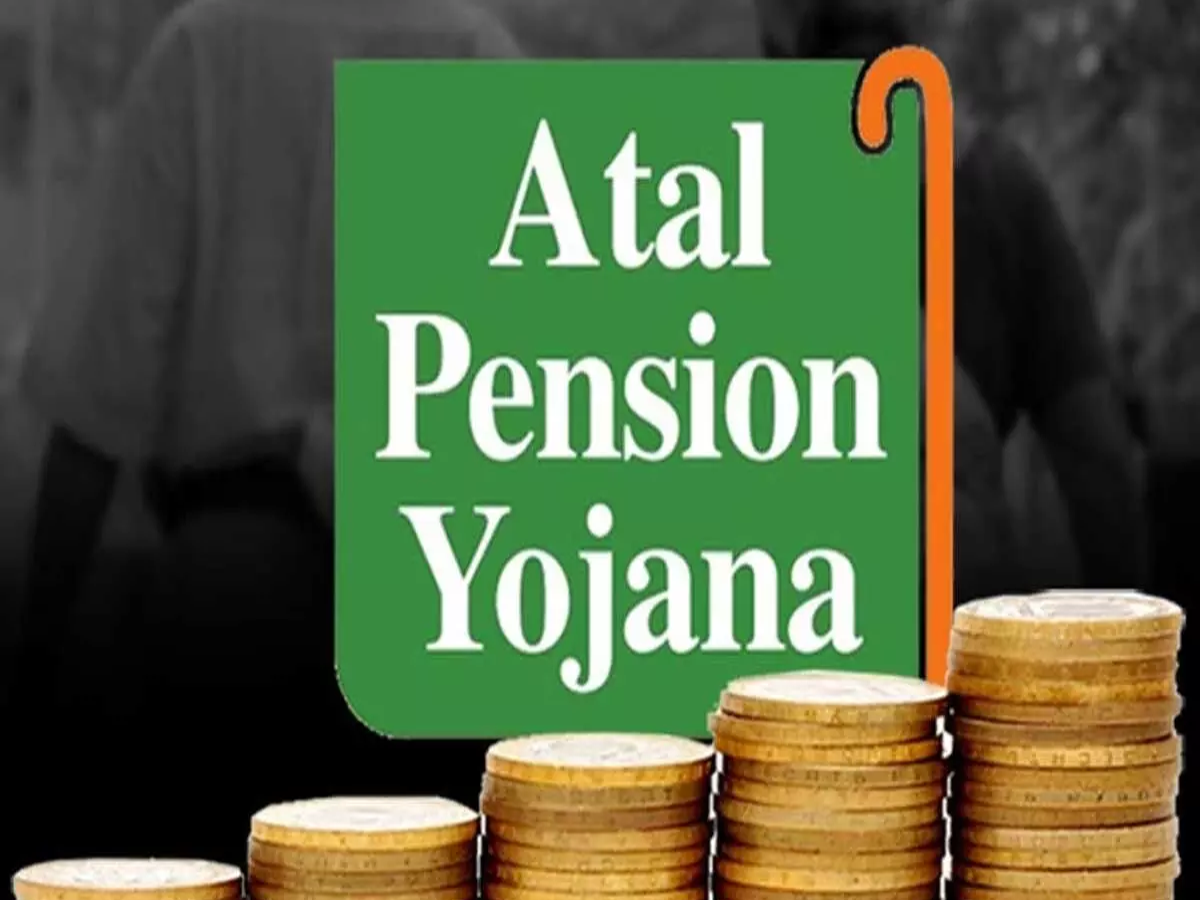 Atal Pension Yojana application form at a bank counter