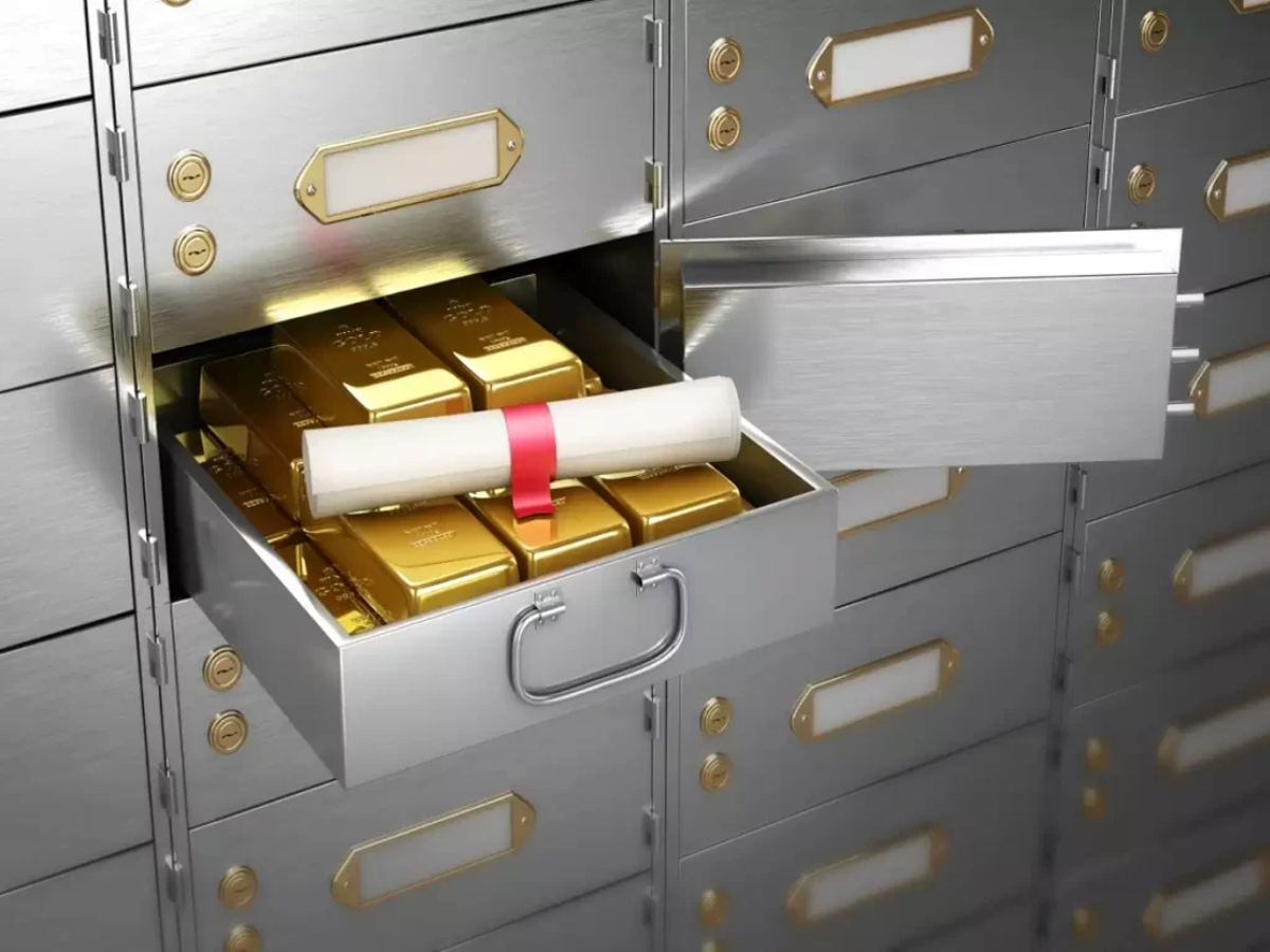 A secure bank locker vault with gold and documents, representing safety and trust.