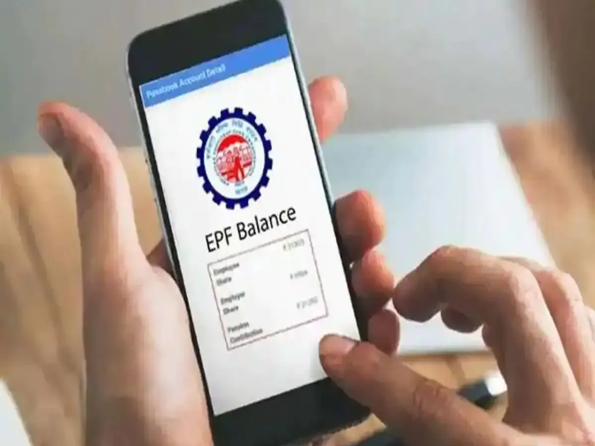 Person checking EPF balance on mobile phone via missed call or SMS