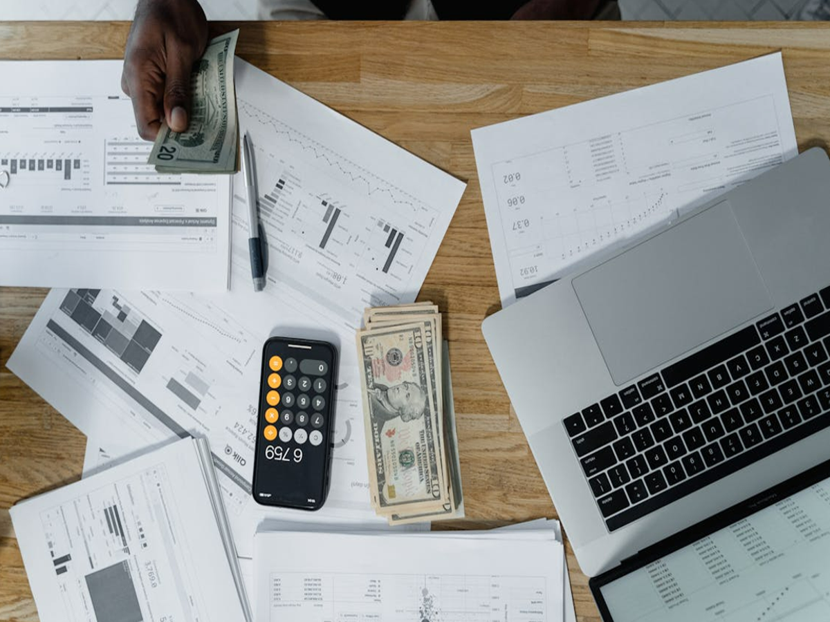 Person checking credit score report on a laptop for financial planning.