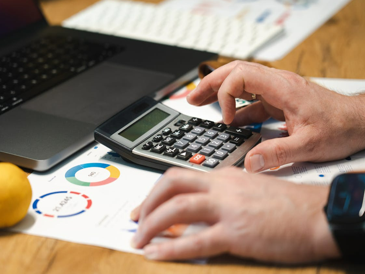 Illustration of a credit card being cancelled with a graph showing credit score impact.
