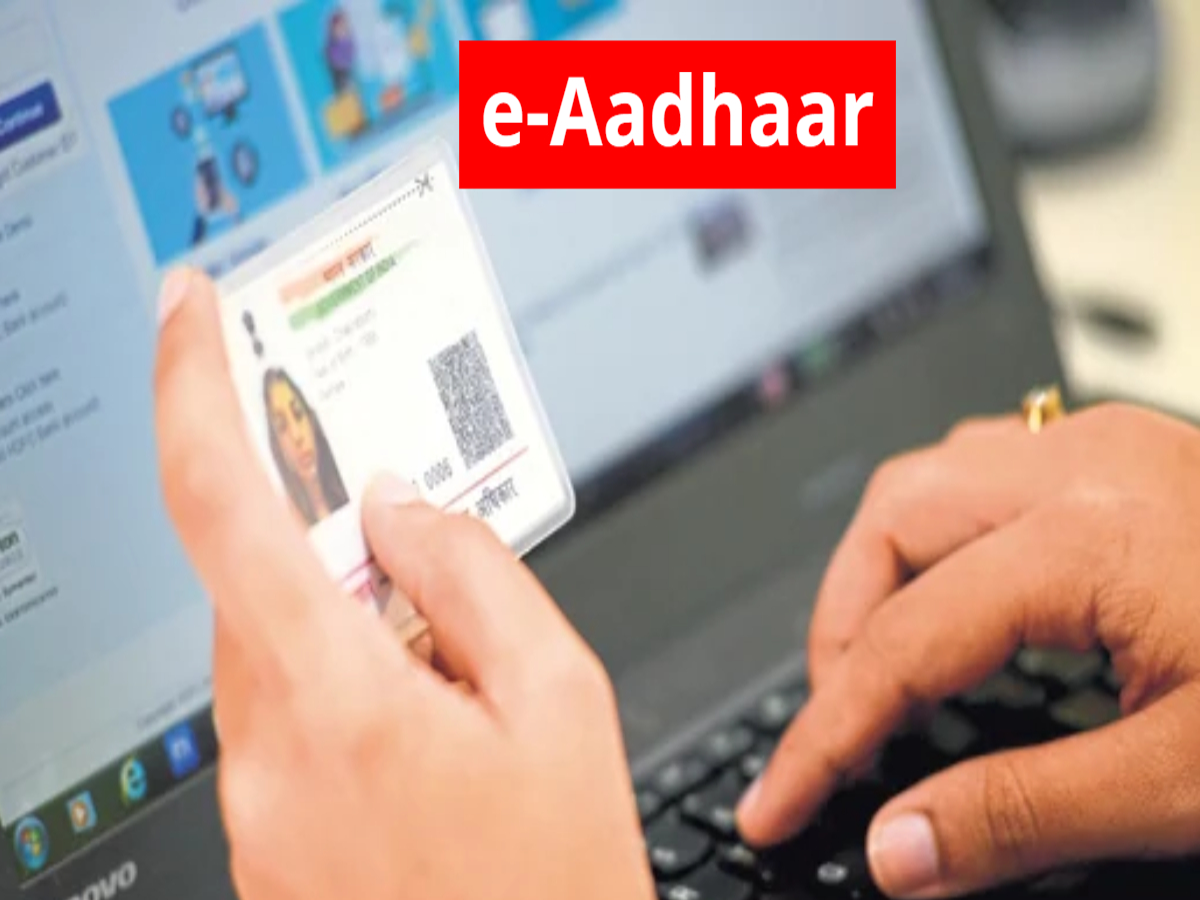 Person using e-Aadhaar app with QR code and Face ID verification.