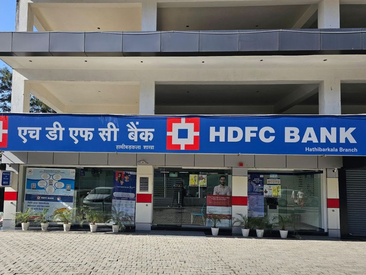 Senior citizen reviewing fixed deposit interest rates at a bank counter, optimized for SEO.