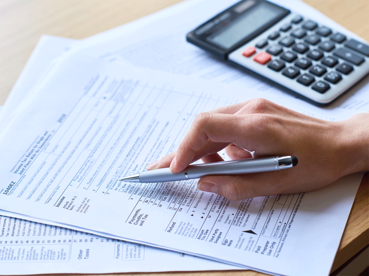 Documents like rental receipts and tax certificates, illustrating the importance of proper documentation for ITR filing.