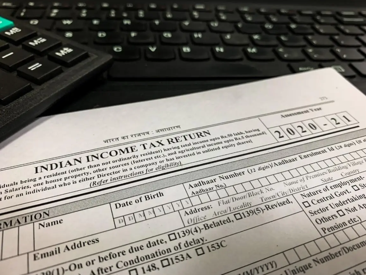 Illustration of a house with a tax form, representing house property income and ITR filing.