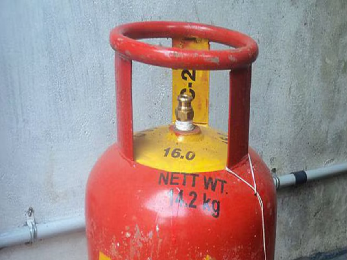 Close-up of LPG cylinder handle showing testing date code