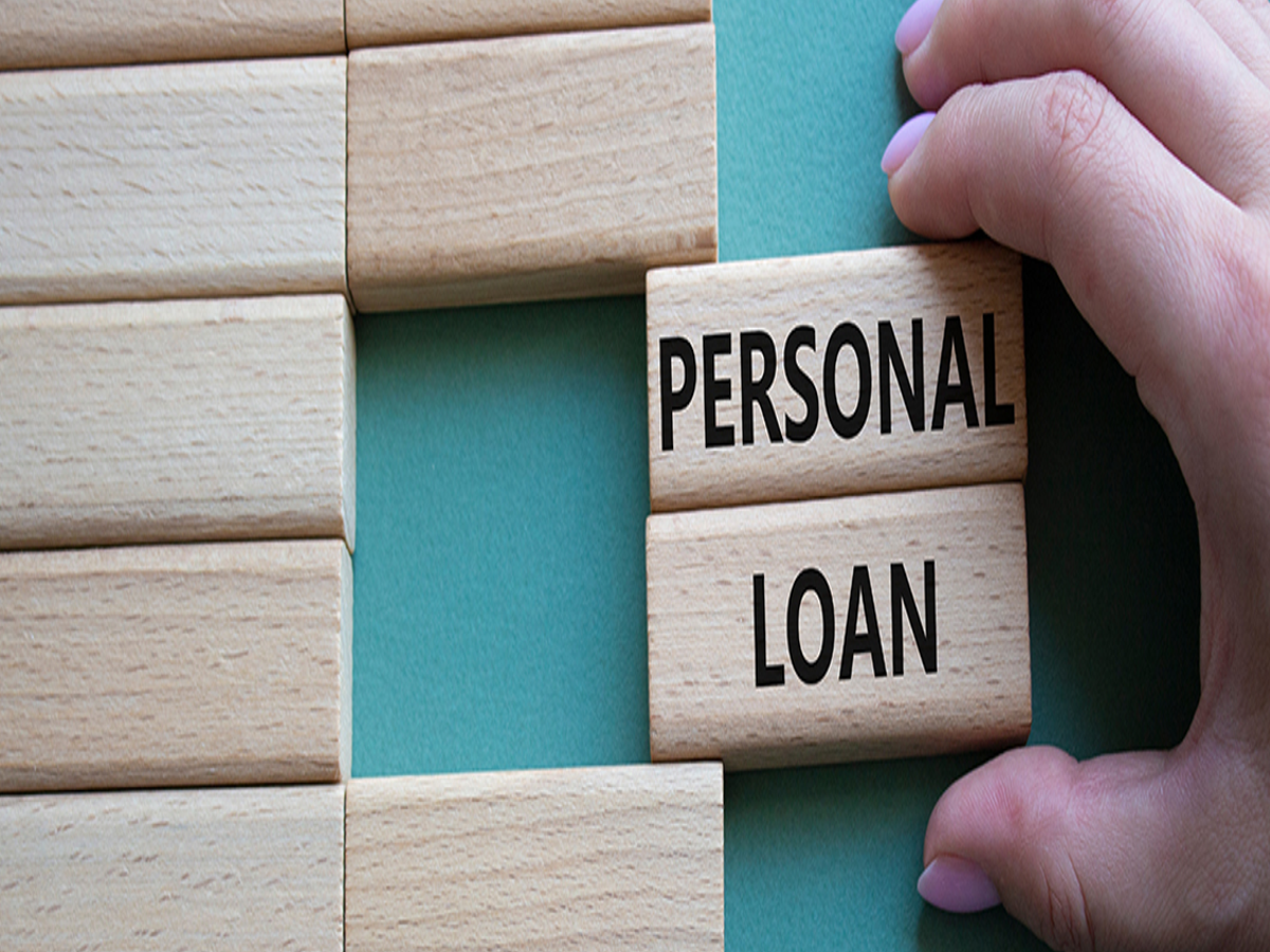 Calculator and financial documents, representing budgeting to manage missed personal loan EMI payments.