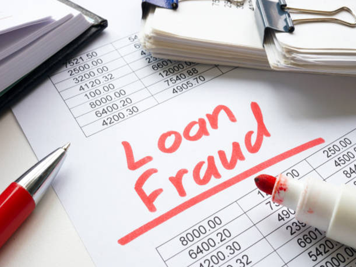 Person checking PAN card loan history on a laptop for financial security