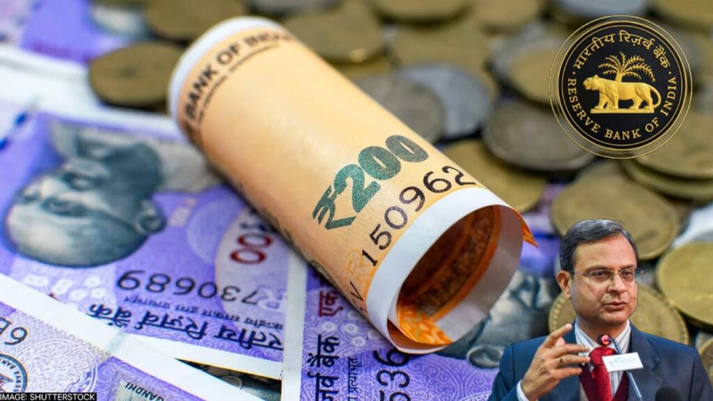 A modern ATM machine dispensing ₹100 and ₹200 notes in Dhanbad, India.