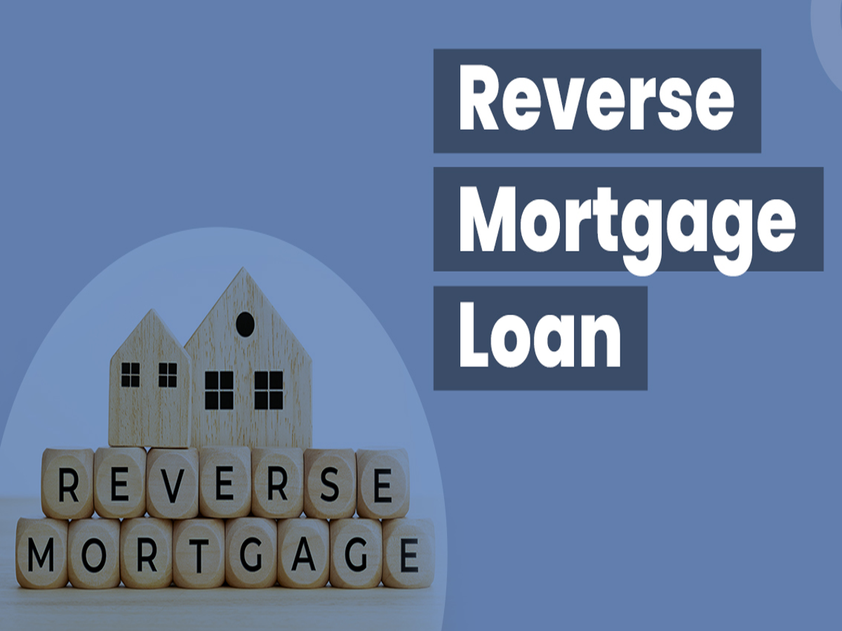 Elderly couple discussing reverse mortgage loan with a bank official