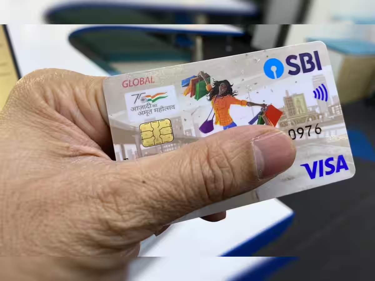 SBI debit card with text overlay about hidden charges on a financial background for a news website.