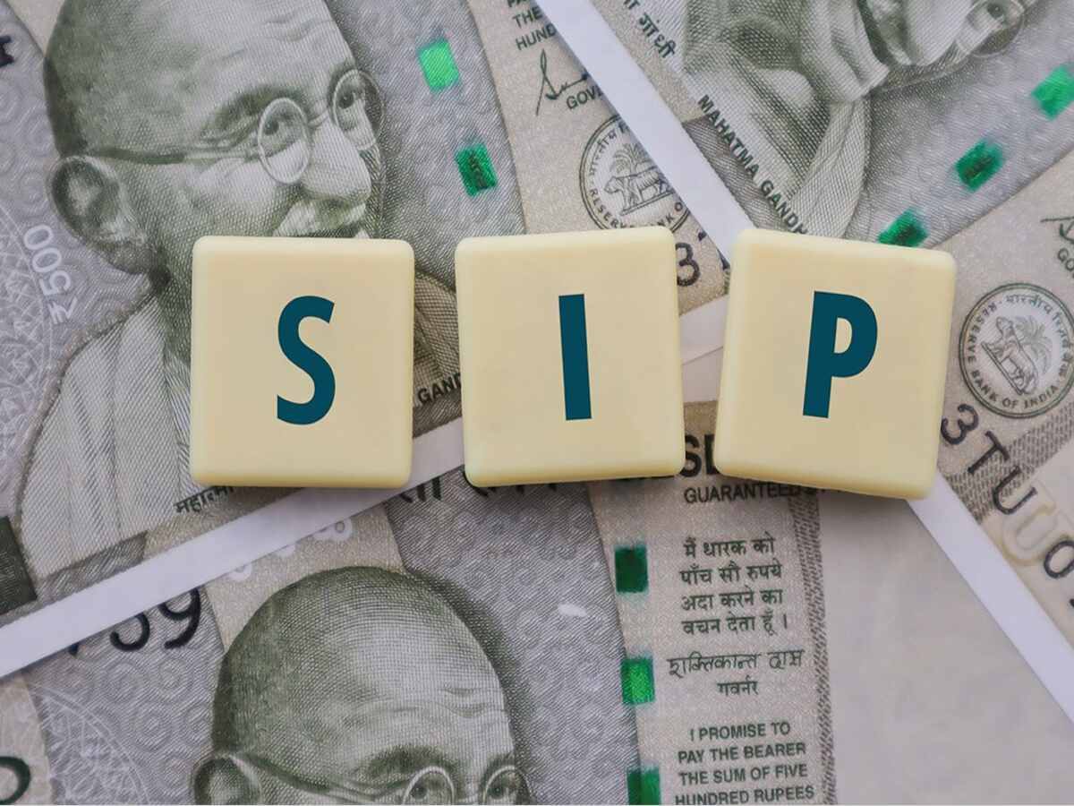 Person investing in SIP through mobile app for long-term wealth creation in 2025.