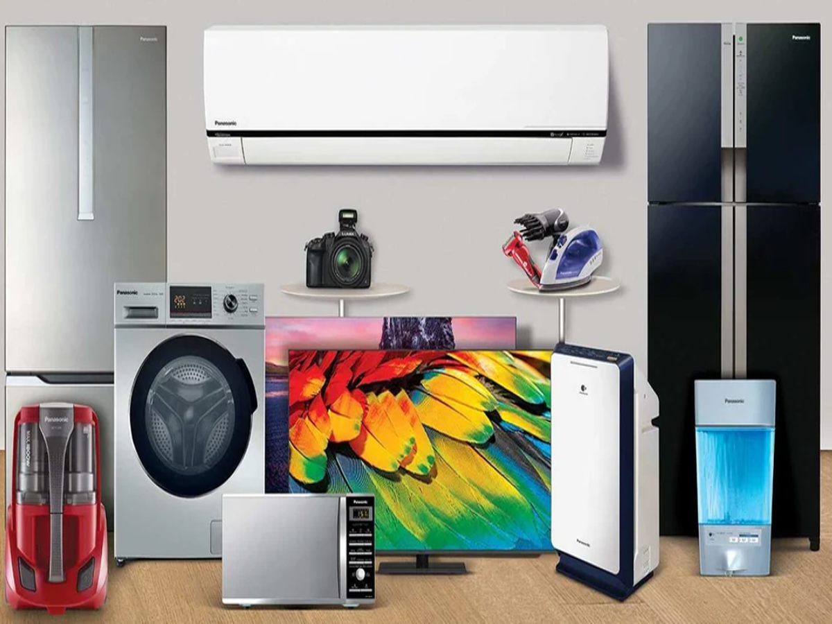 Indian shoppers purchasing electronics like TVs and fridges during a Deepavali sale with discounted prices.