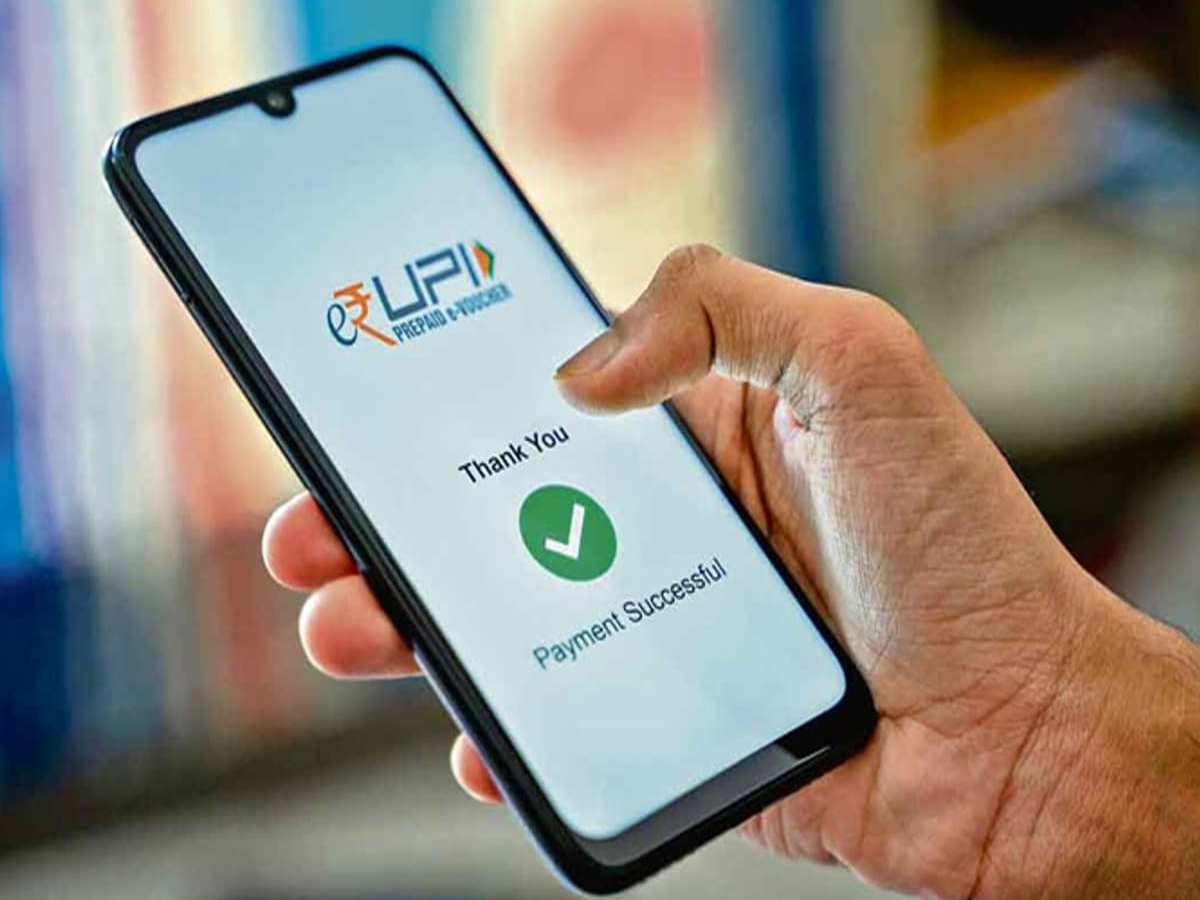 Illustration of a mobile phone displaying a UPI payment interface with transaction growth stats for August 2025.