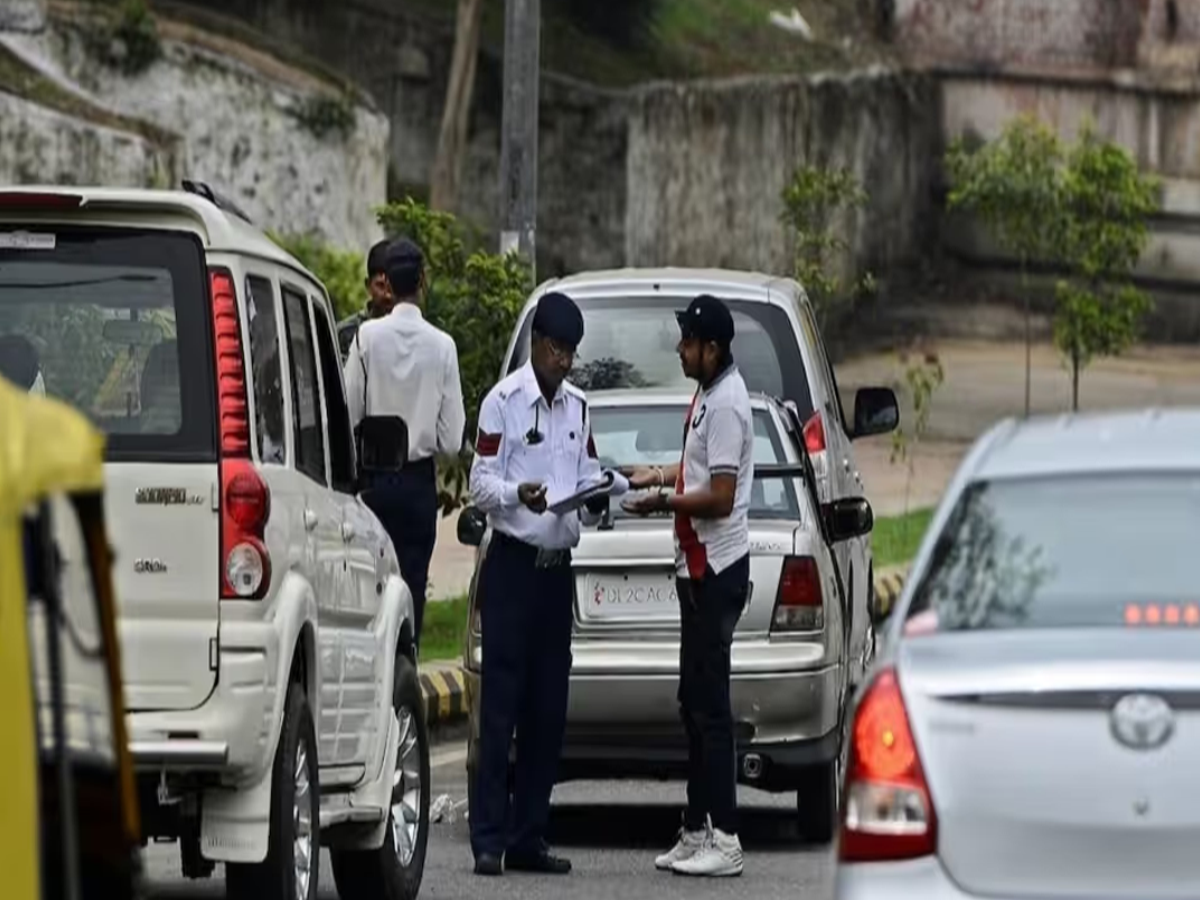 Image of a vehicle owner receiving an SMS notification about a traffic challan on their smartphone.