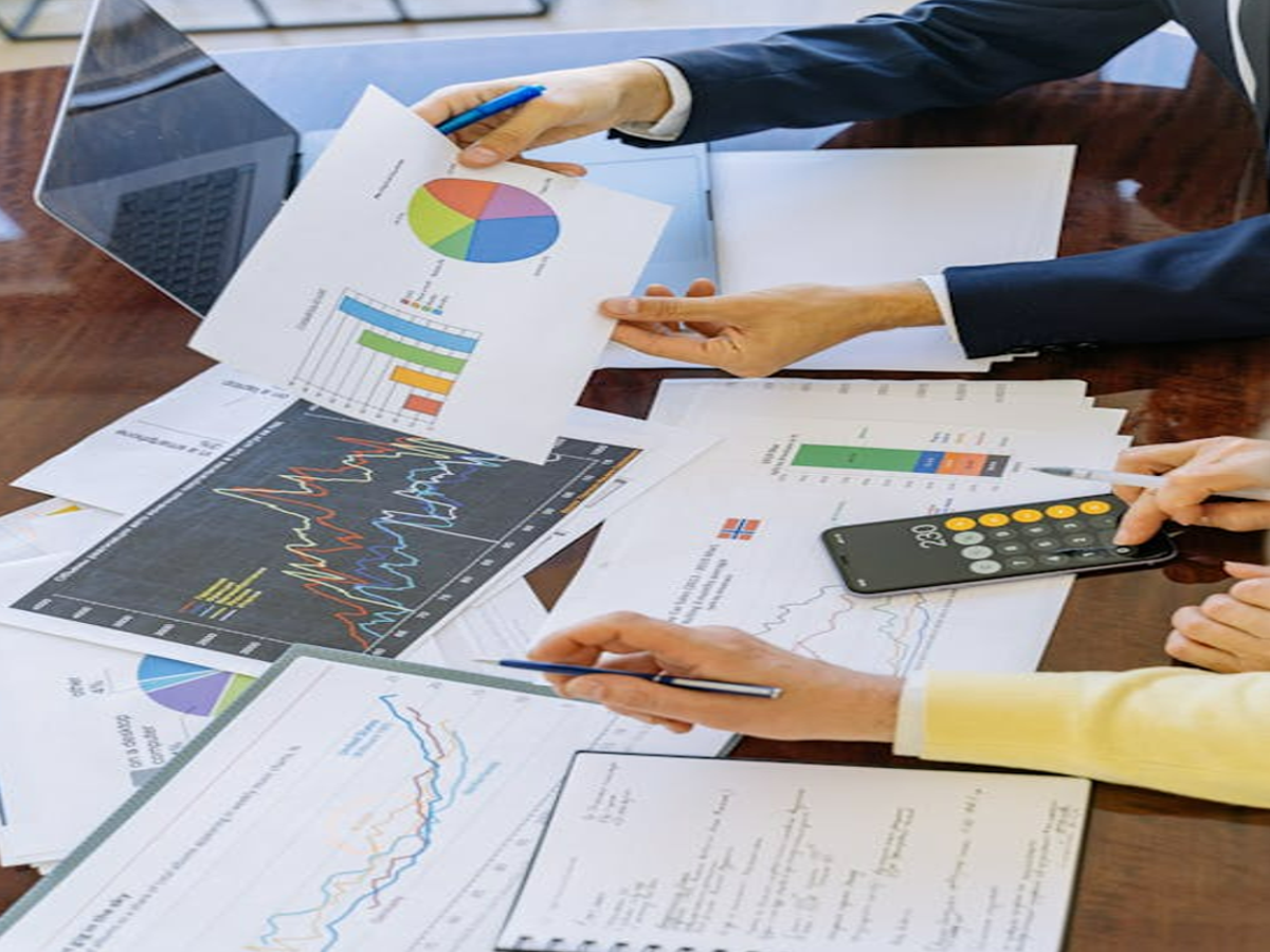 Illustration of a person reviewing a credit report on a laptop, emphasizing financial health.