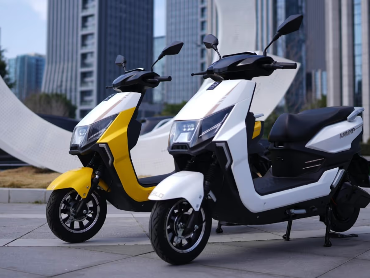 Zelo Knight+ electric scooter in glossy white parked in an urban city street