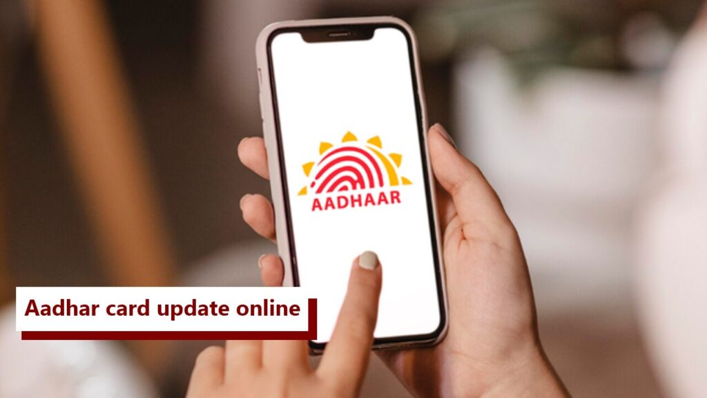 Person updating Aadhaar card details on UIDAI portal using laptop