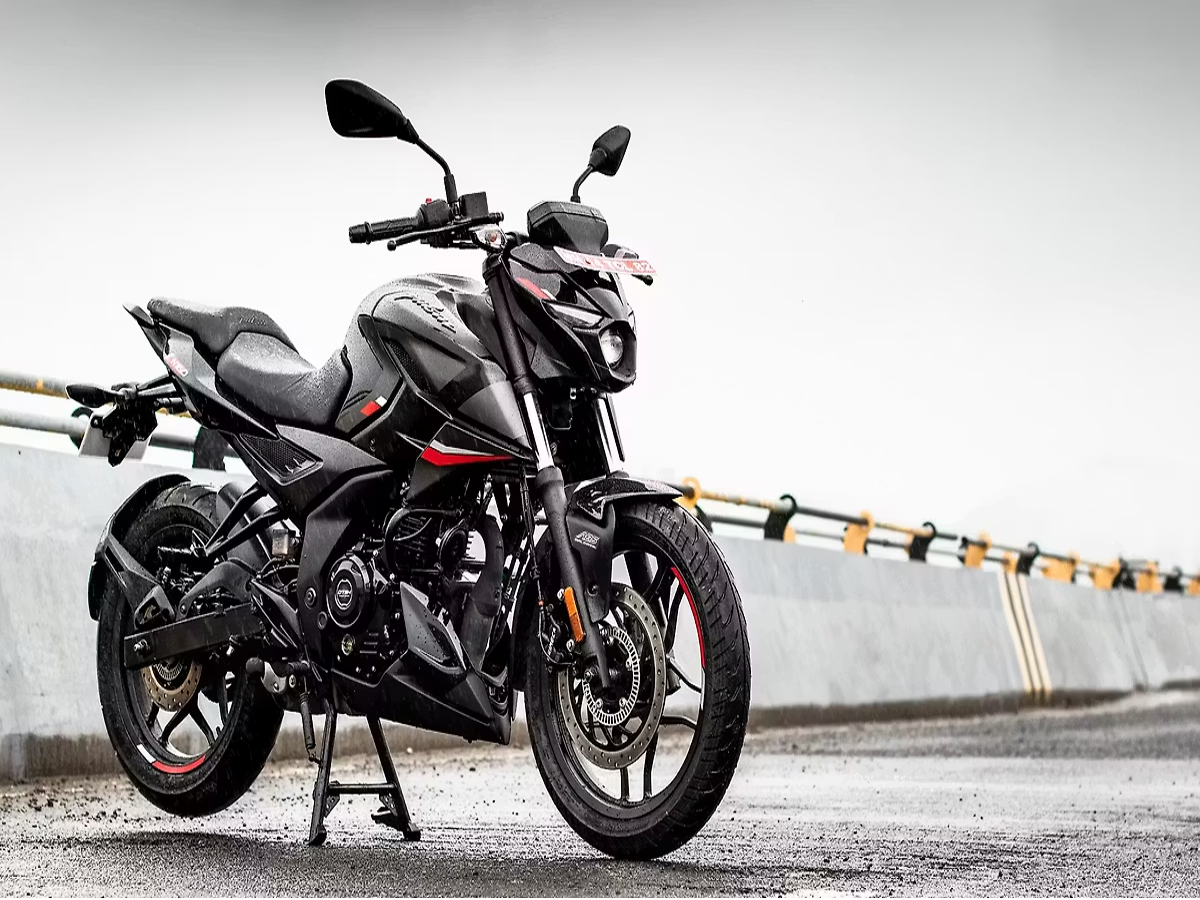 Bajaj Pulsar N160 motorcycle parked on a road, showcasing its sporty design.