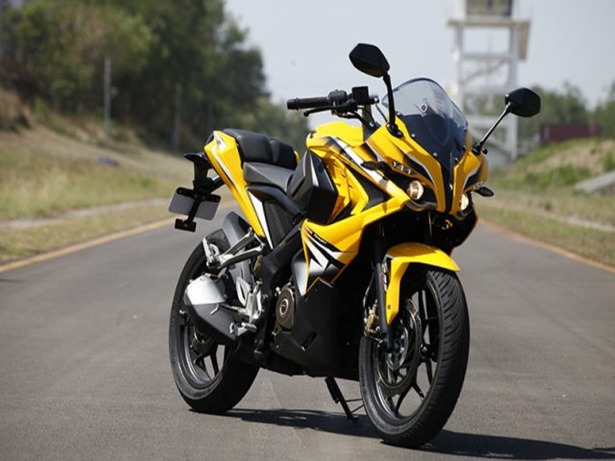 Bajaj Pulsar RS200 parked in an urban setting, highlighting its aggressive fairing and projector headlamps.