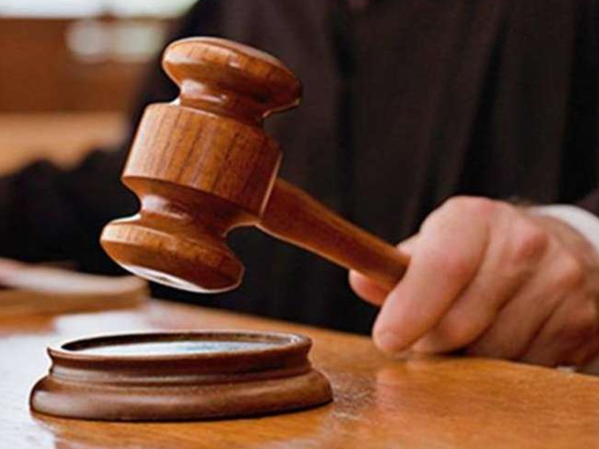 Gavel and legal documents on a table, symbolizing the Delhi High Court ruling on property rights.